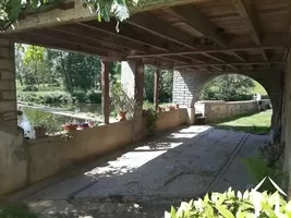 Drive through arch on rear side of mill building