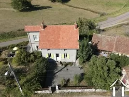 house with barn and open barn to the right