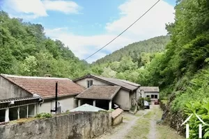 complex of 5 dwellings on edge of river