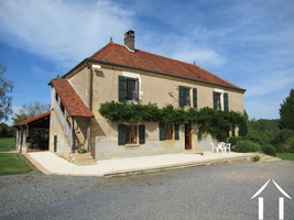 House with large garage and sheds