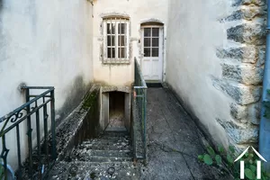 Stairs to wine cellar and door to main entrance